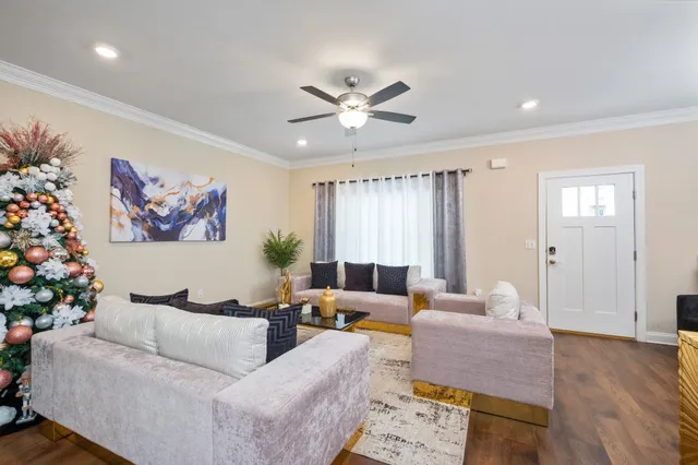 a living room with furniture and a large window