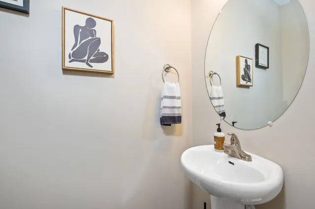 a bathroom with a sink and mirror