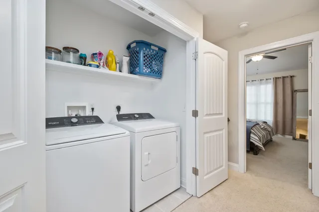 a view of hallway with washer and dryer