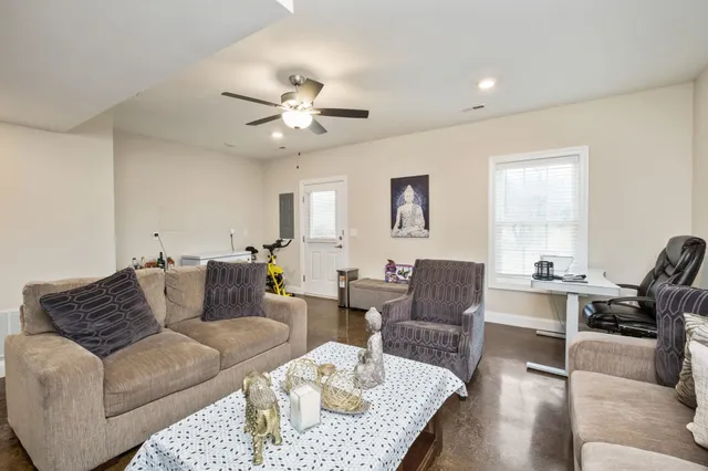 a living room with furniture or couch and a window