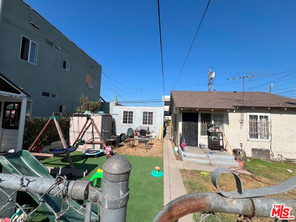 737 Lime Avenue Long Beach, CA 90813 - Photo 10 of 19 a view of a patio with table and chairs under an umbrella