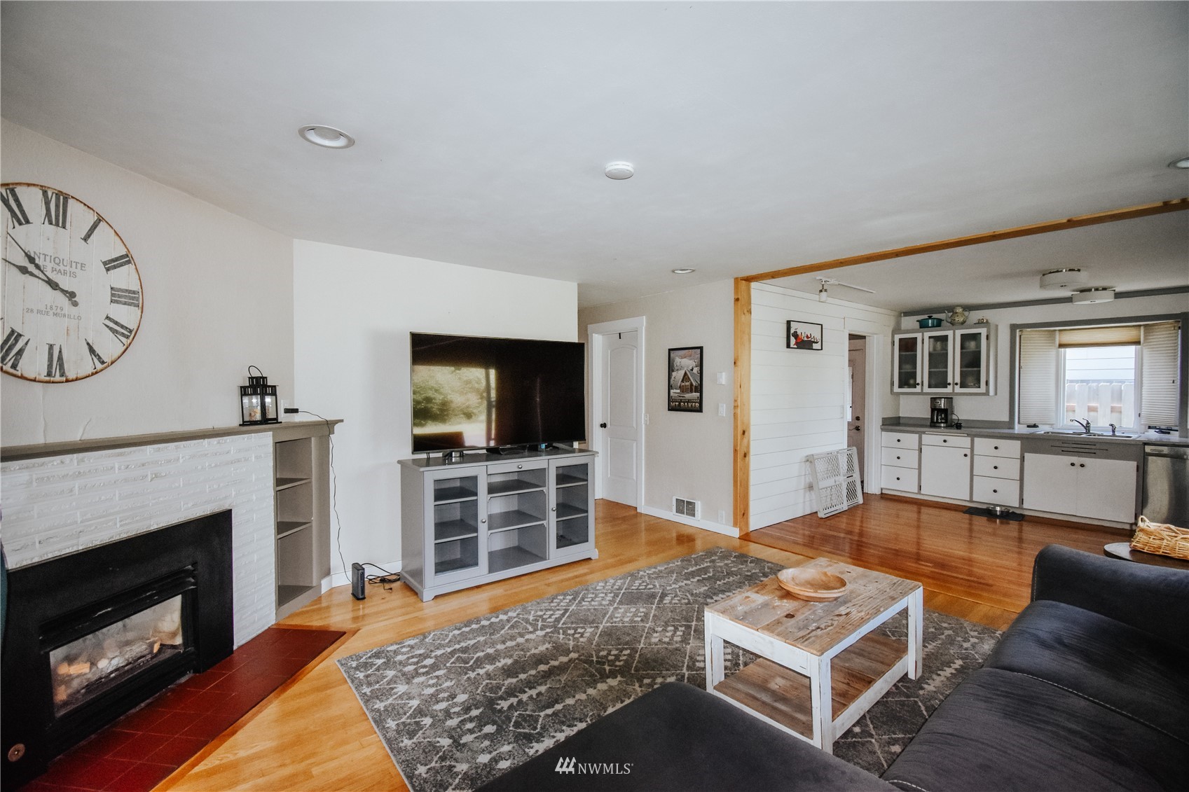 1375 West Smith Road Ferndale, WA 98248 - Photo 10 of 19 a living room with furniture a flat screen tv and a fireplace