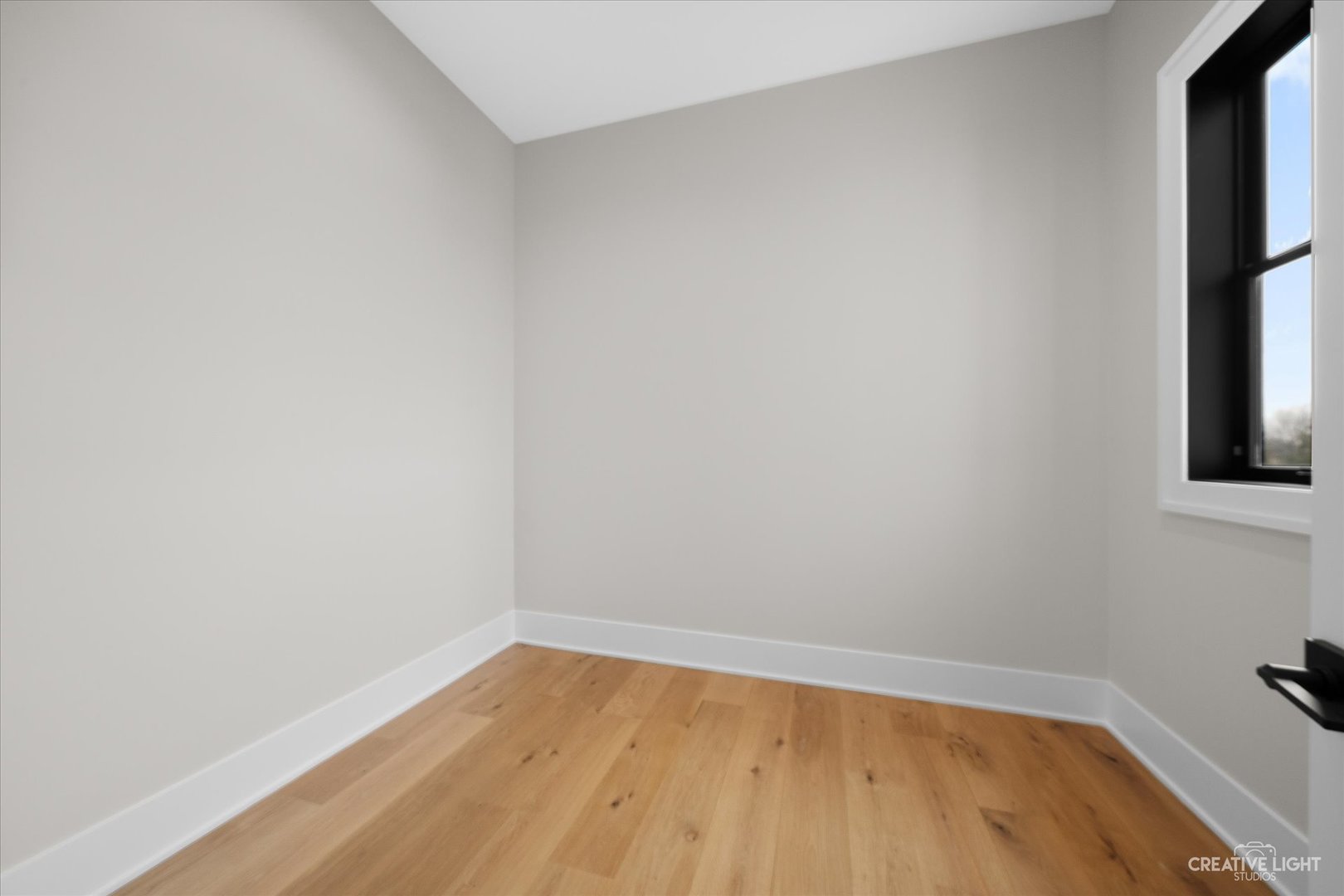 4764 Minooka Road Minooka, IL 60447 - Photo 18 of 39 a view of an empty room with wooden floor and a window
