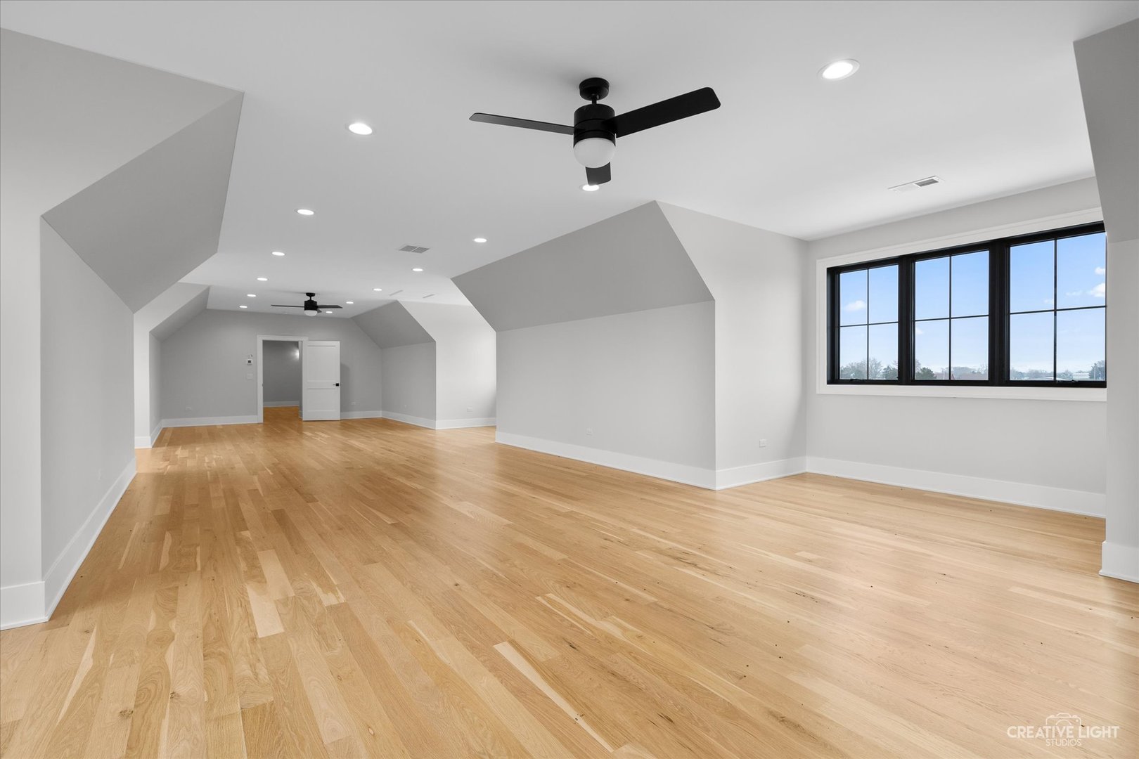 4764 Minooka Road Minooka, IL 60447 - Photo 33 of 39 a view of empty room with wooden floor and fan