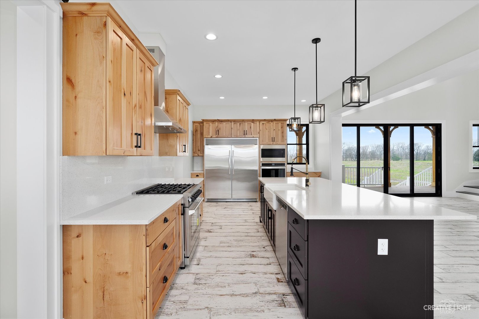 4764 Minooka Road Minooka, IL 60447 - Photo 8 of 39 a large kitchen with stainless steel appliances kitchen island granite countertop a sink and cabinets
