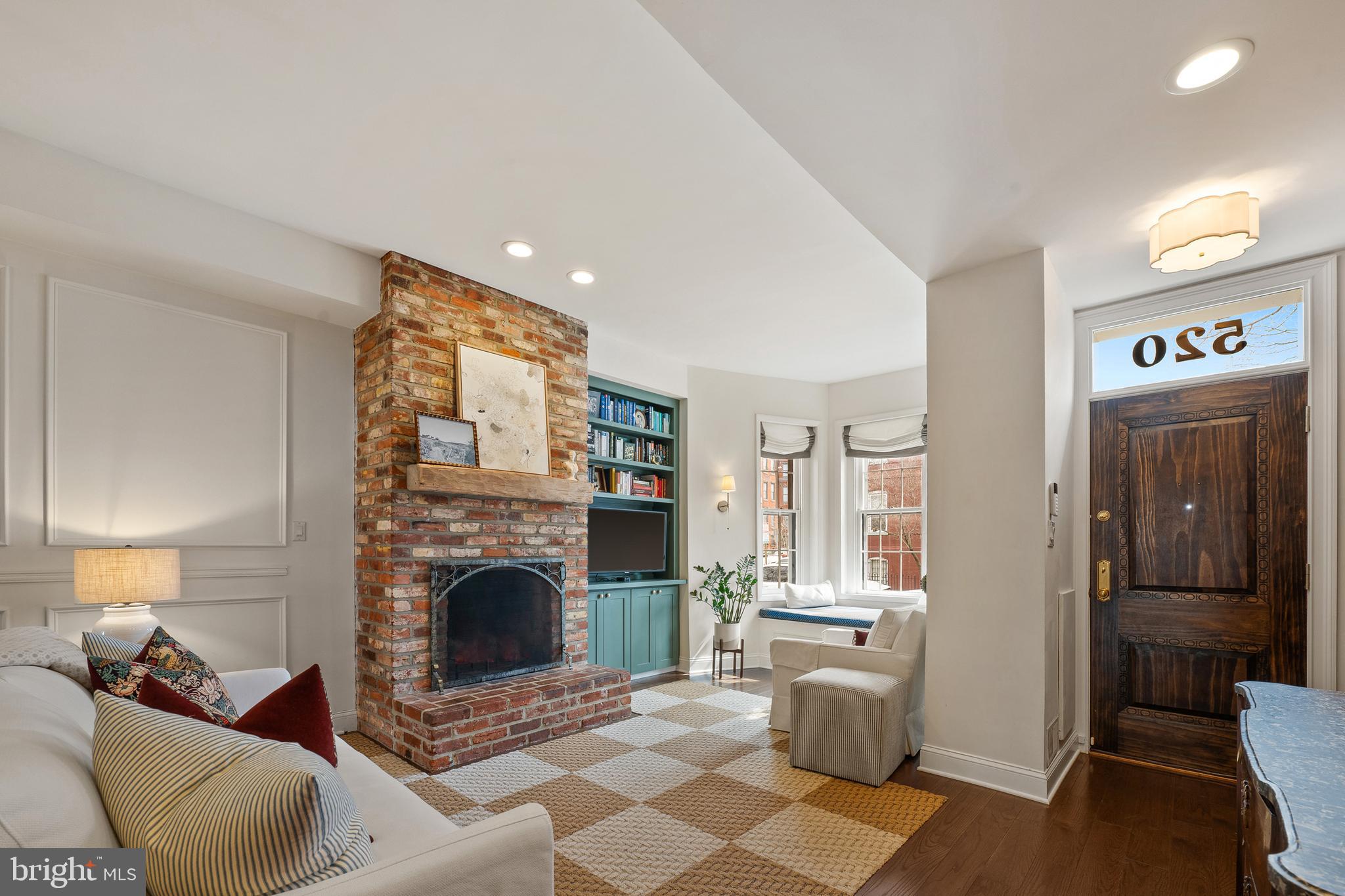 520 D Street Northeast Washington, DC 20002 - Photo 2 of 15 a living room with furniture and a fireplace