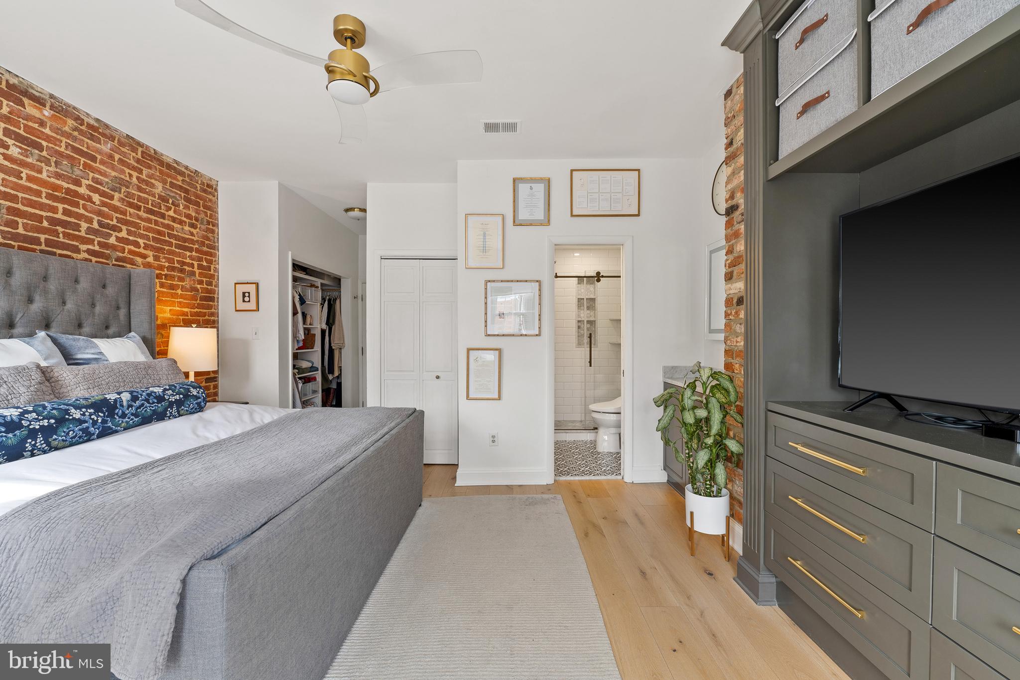 520 D Street Northeast Washington, DC 20002 - Photo 8 of 15 a bedroom with a bed and a flat screen tv