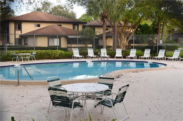 a view of a swimming pool with a house