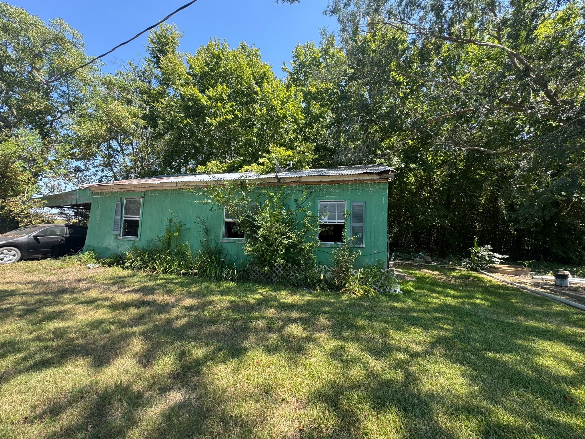 3002 County Road 166 Road Wharton, TX 77488 - Photo 5 of 6 a view of a house with a yard