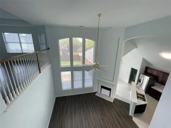 a view of an entryway with wooden floor
