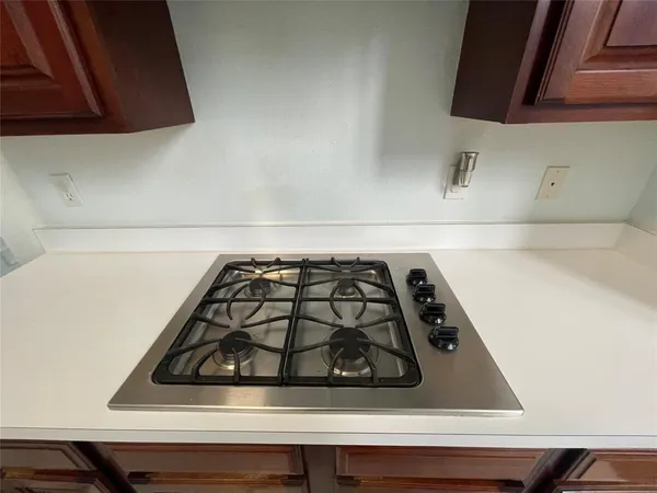 a close view of a stove top oven sitting inside of a kitchen