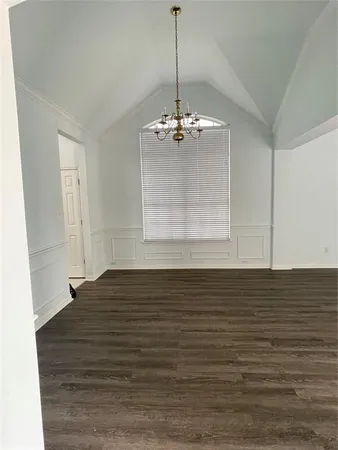 a view of a room window and wooden floor