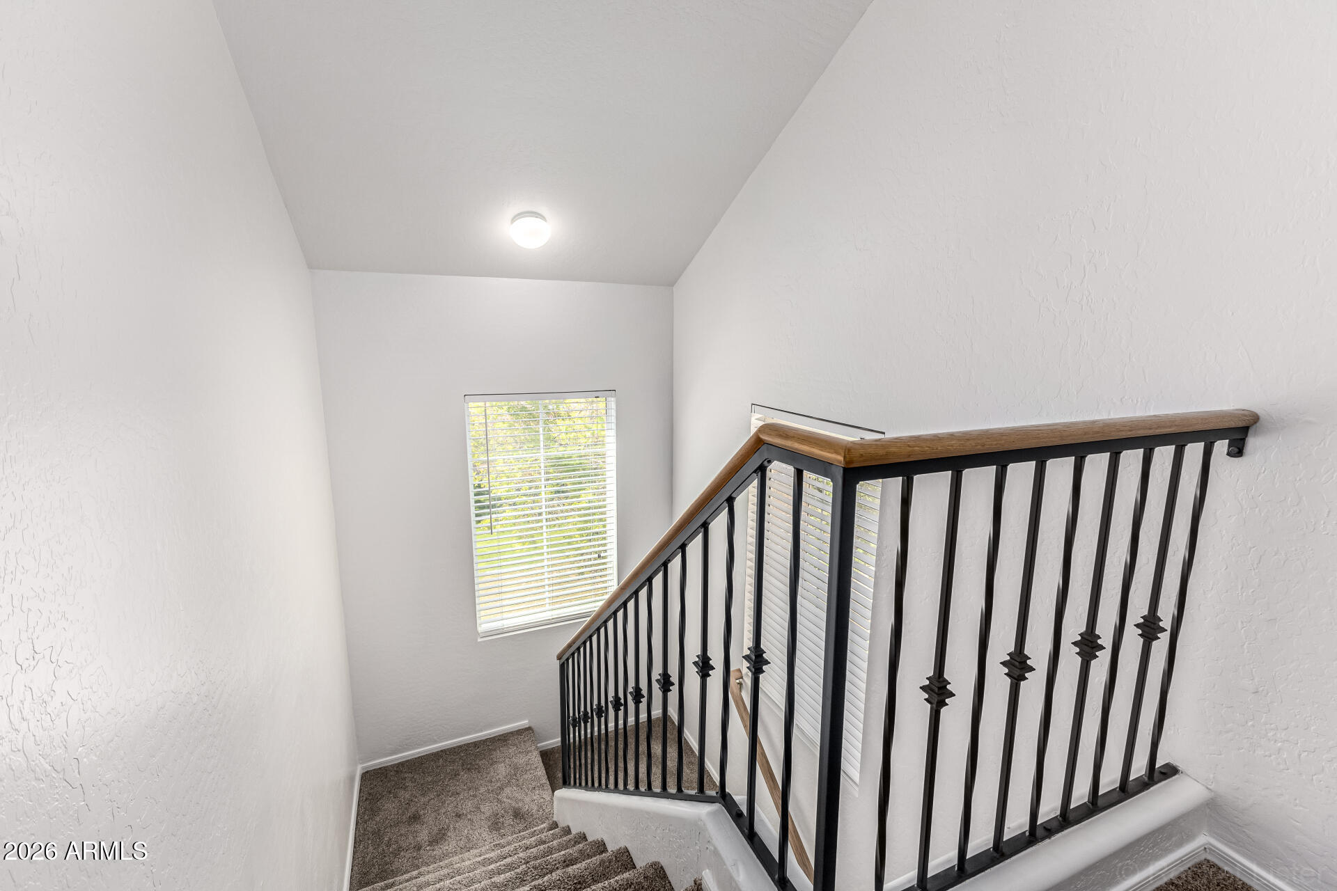 970 West Aspen Way Gilbert, AZ 85233 - Photo 11 of 36 a view of a hallway with wooden floor and a bathroom