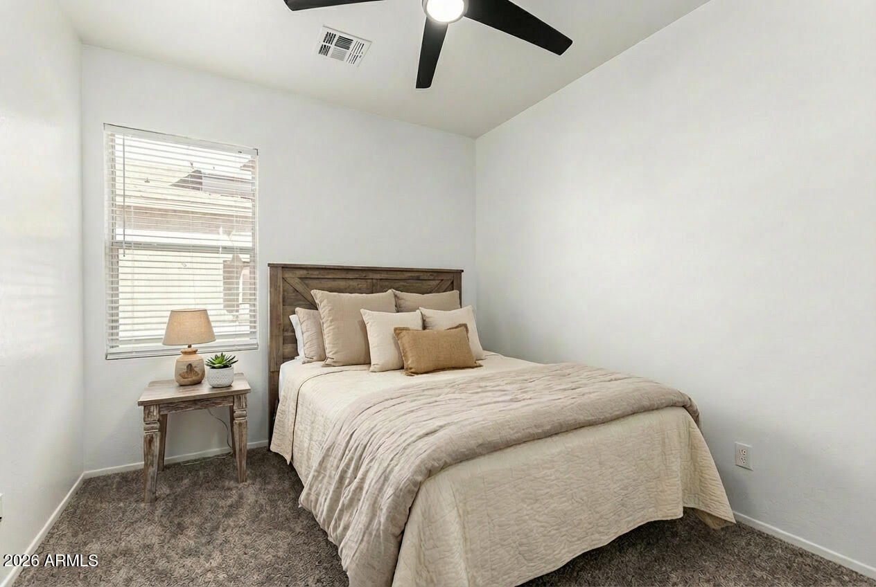 970 West Aspen Way Gilbert, AZ 85233 - Photo 12 of 36 a bedroom with a bed and a window