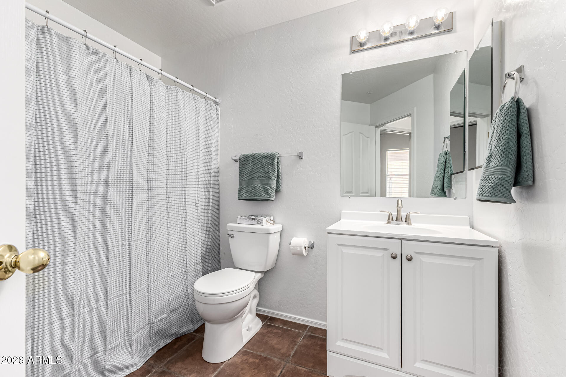 970 West Aspen Way Gilbert, AZ 85233 - Photo 13 of 36 a bathroom with a toilet sink and mirror