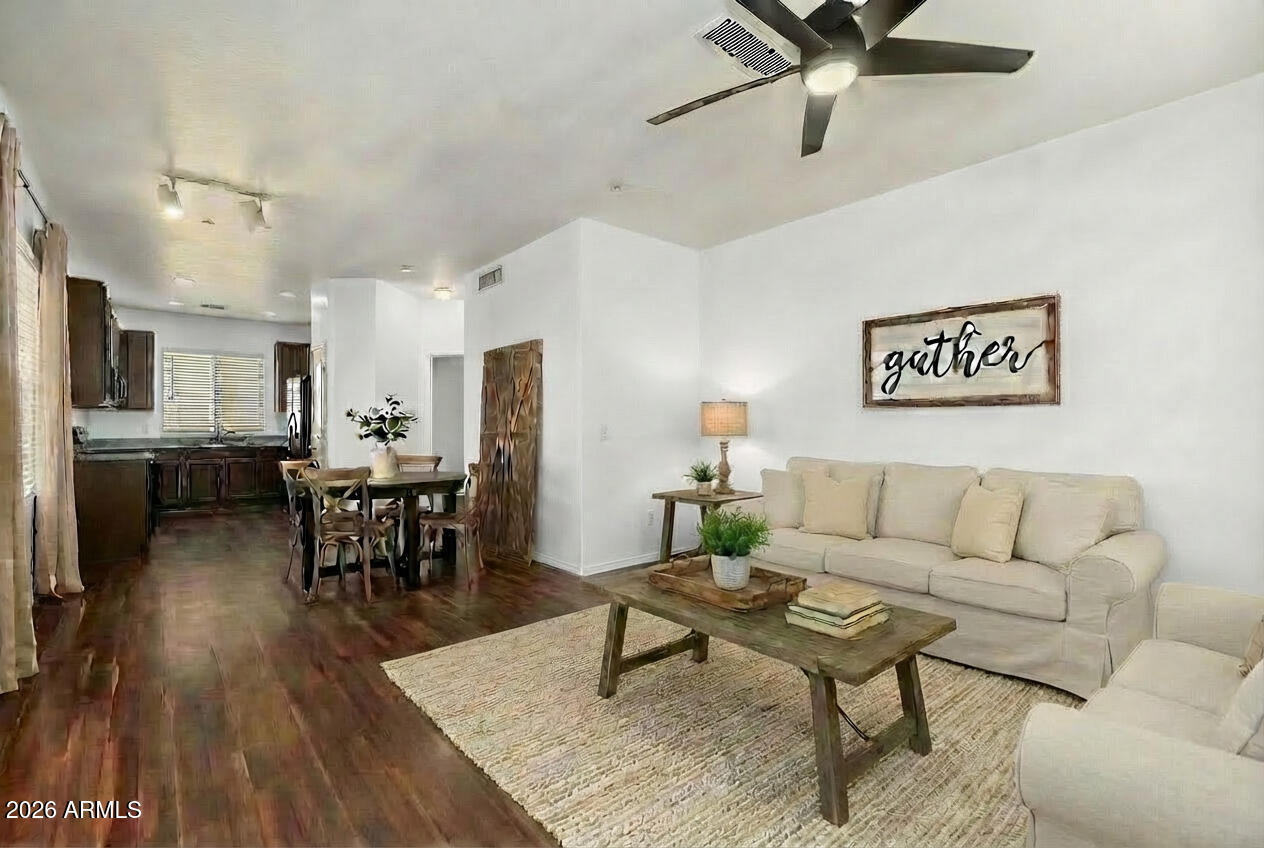 970 West Aspen Way Gilbert, AZ 85233 - Photo 2 of 36 a living room with furniture and a wooden floor