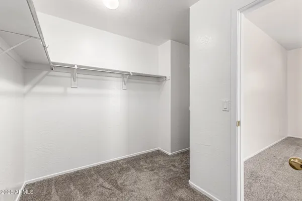 a view of an empty walk in closet