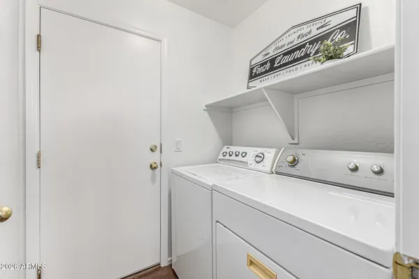 a utility room with dryer and washer