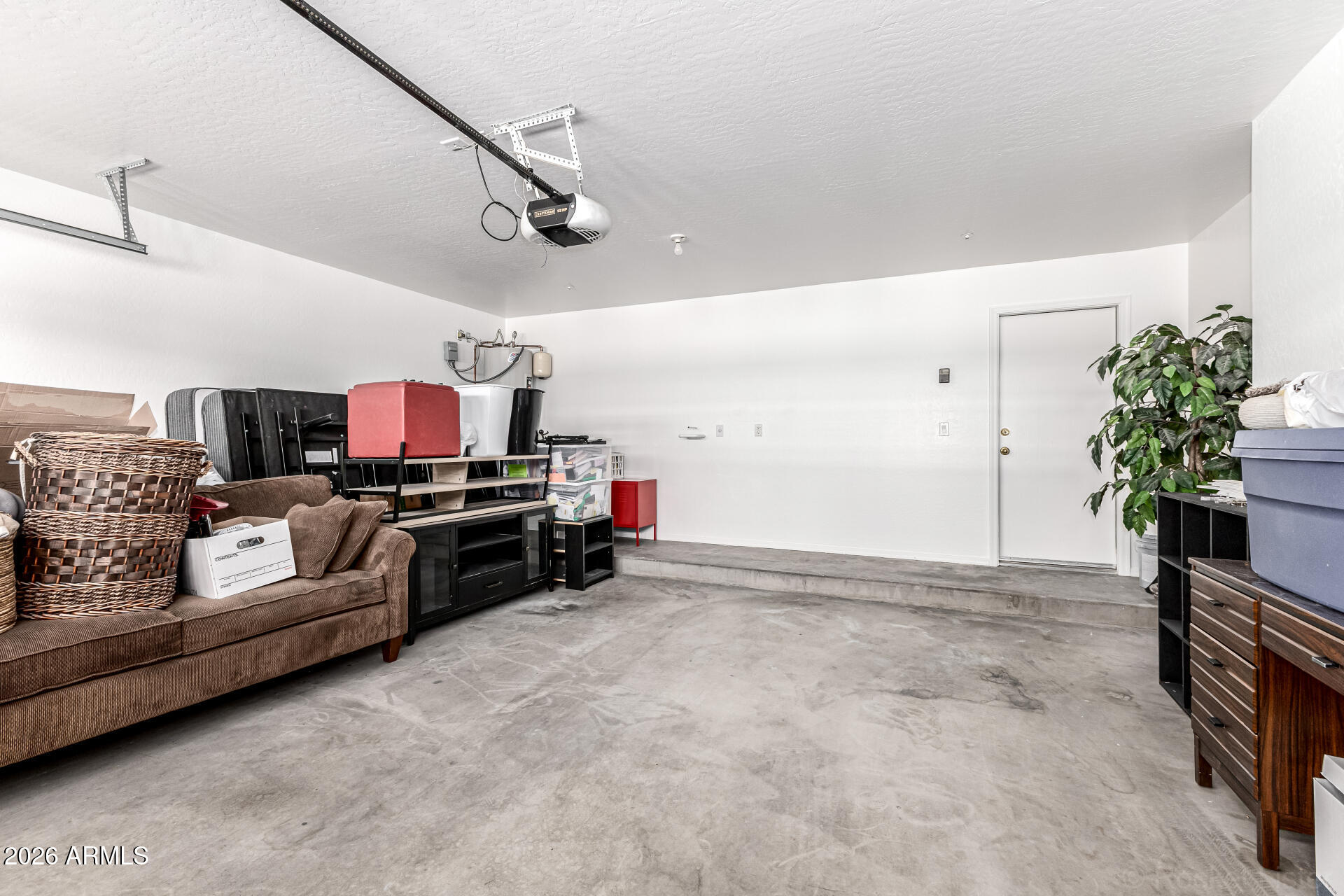 970 West Aspen Way Gilbert, AZ 85233 - Photo 27 of 36 a living room with furniture and a flat screen tv