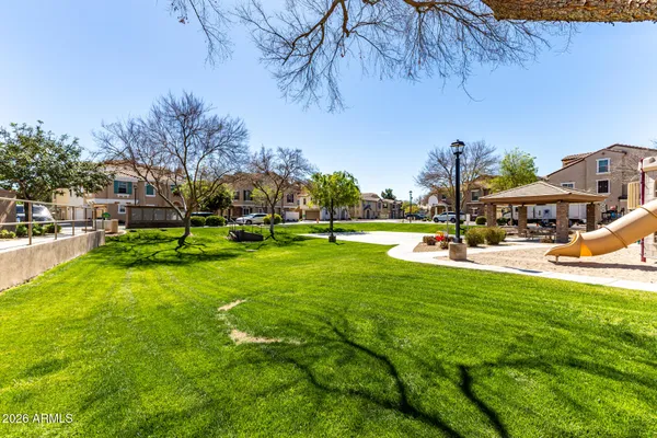 a view of a park with houses