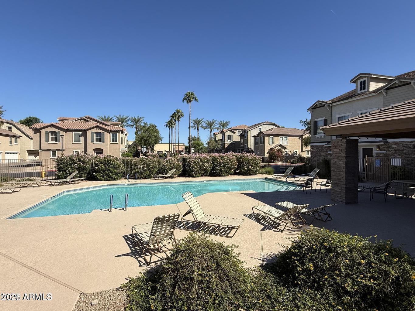 970 West Aspen Way Gilbert, AZ 85233 - Photo 34 of 36 a view of a house with a swimming pool