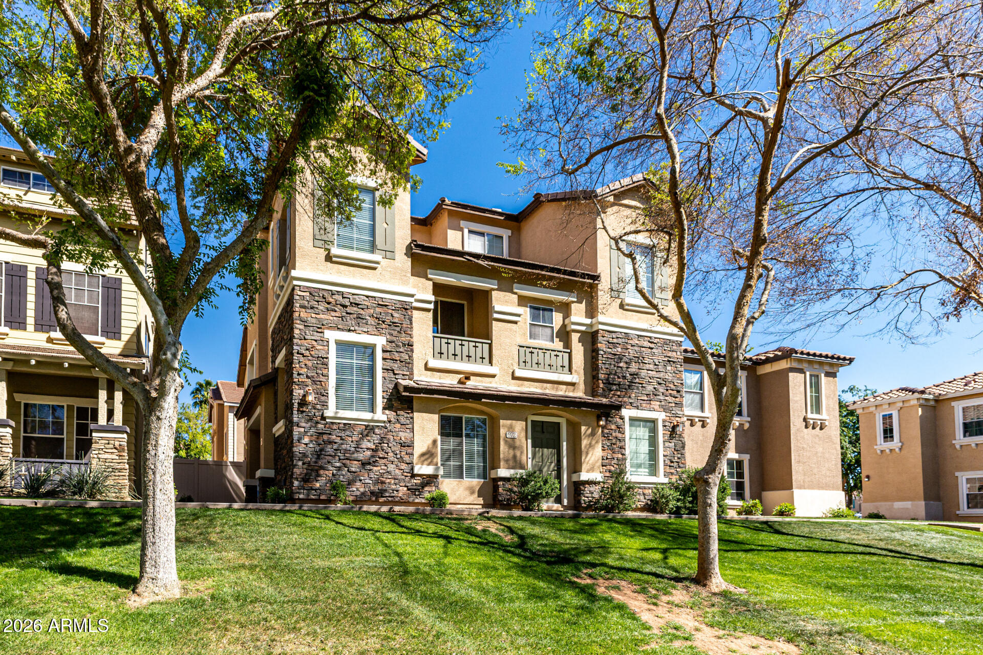 970 West Aspen Way Gilbert, AZ 85233 - Photo 6 of 36 a view of a building with a yard