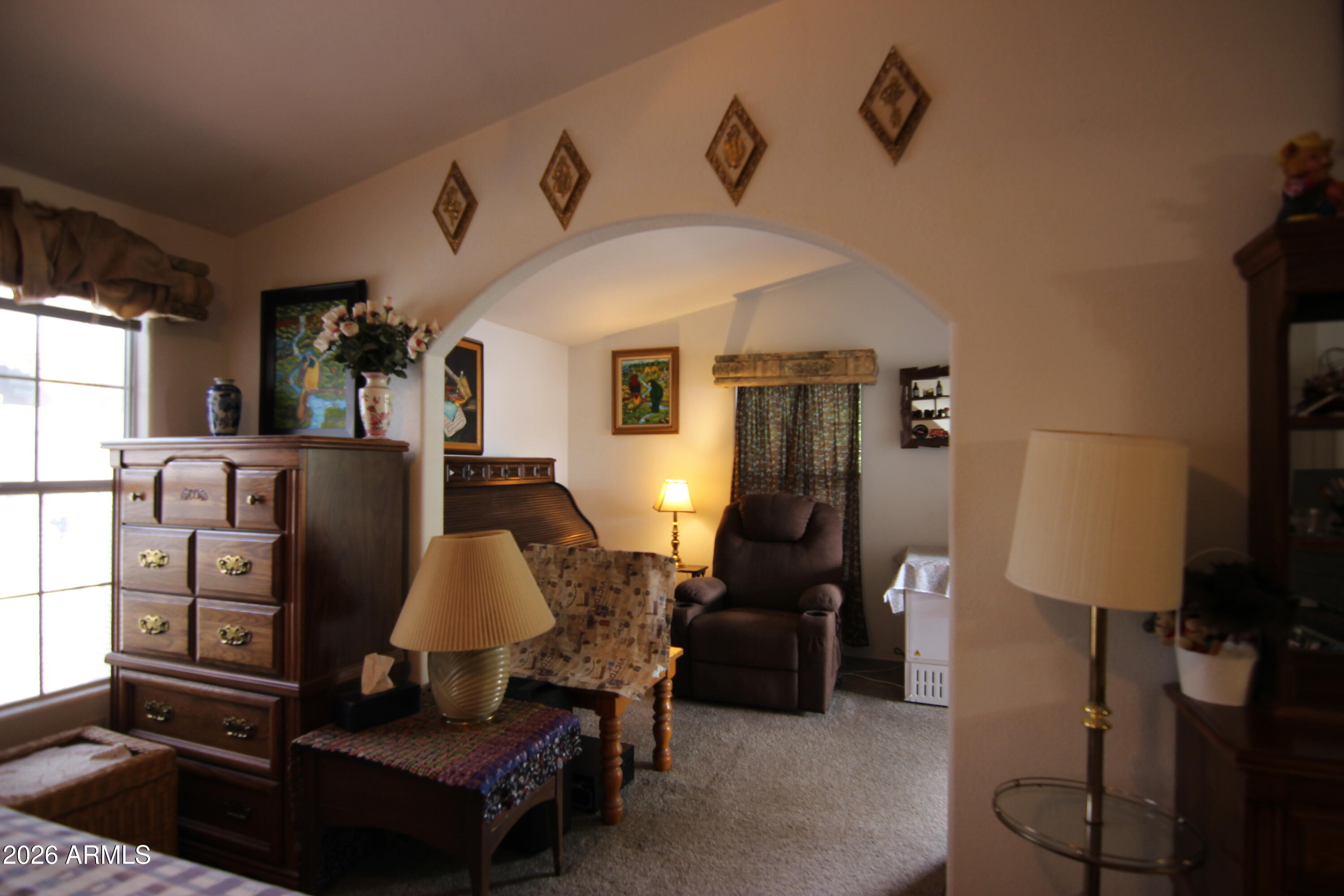 201 South Greenfield Road, Unit 268 Mesa, AZ 85206 - Photo 13 of 22 a living room with furniture and a flat screen tv