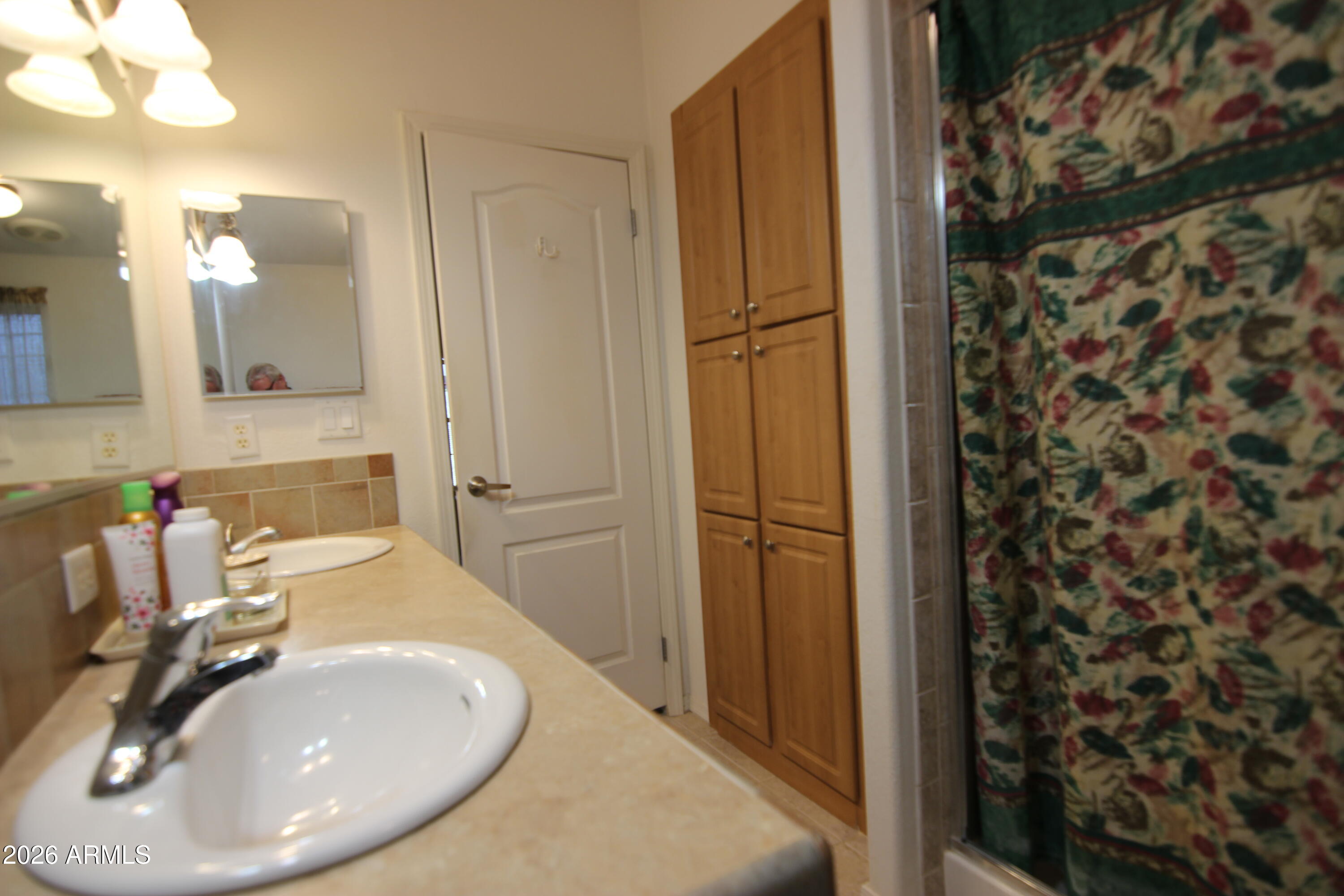 201 South Greenfield Road, Unit 268 Mesa, AZ 85206 - Photo 14 of 22 a bathroom with a sink and a mirror
