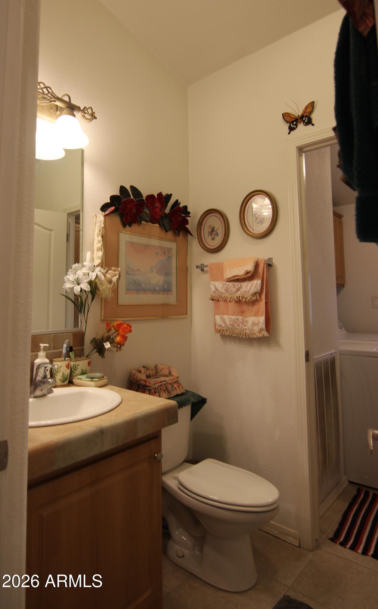 201 South Greenfield Road, Unit 268 Mesa, AZ 85206 - Photo 16 of 22 a bathroom with a sink and a toilet