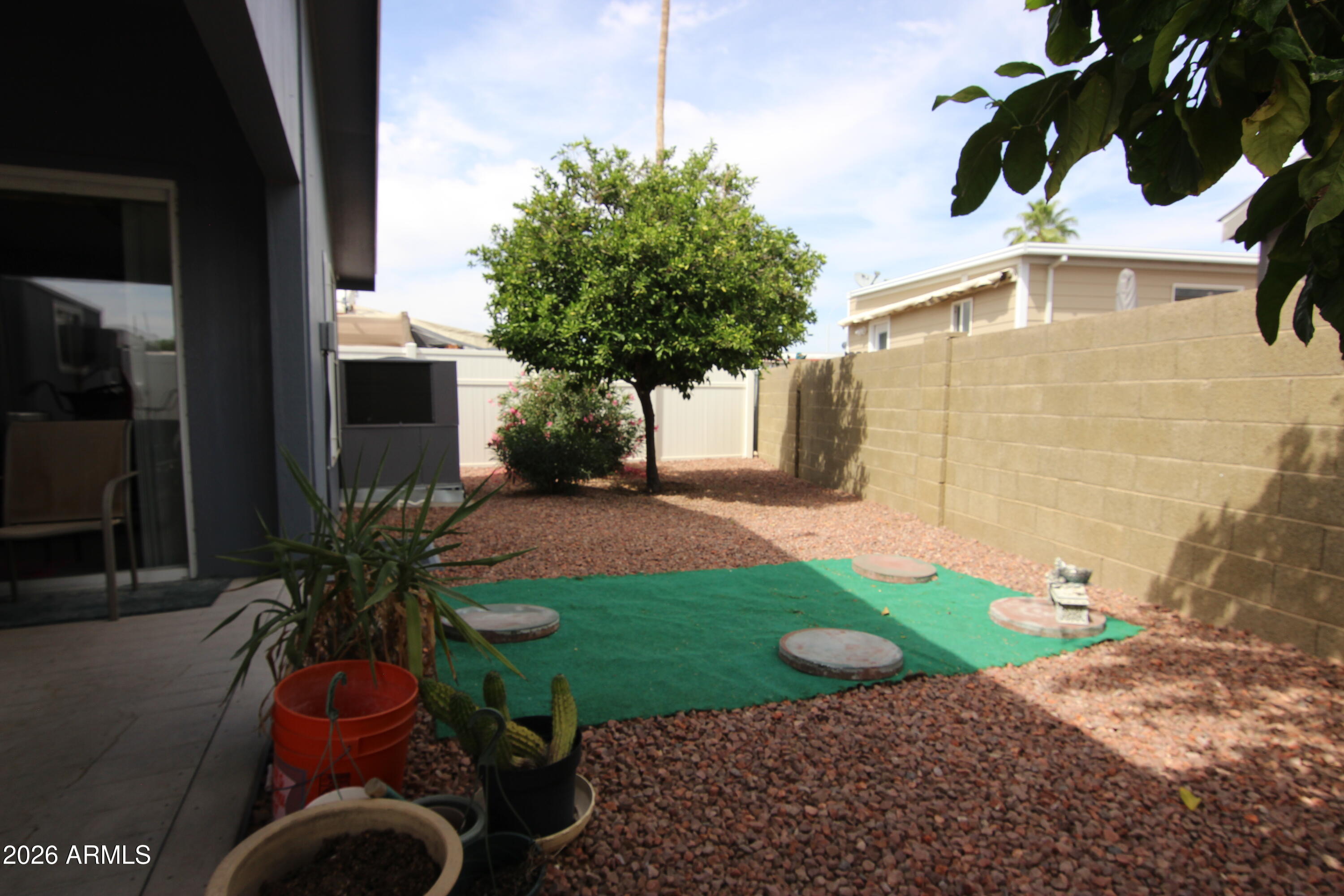 201 South Greenfield Road, Unit 268 Mesa, AZ 85206 - Photo 19 of 22 a view of backyard with outdoor seating