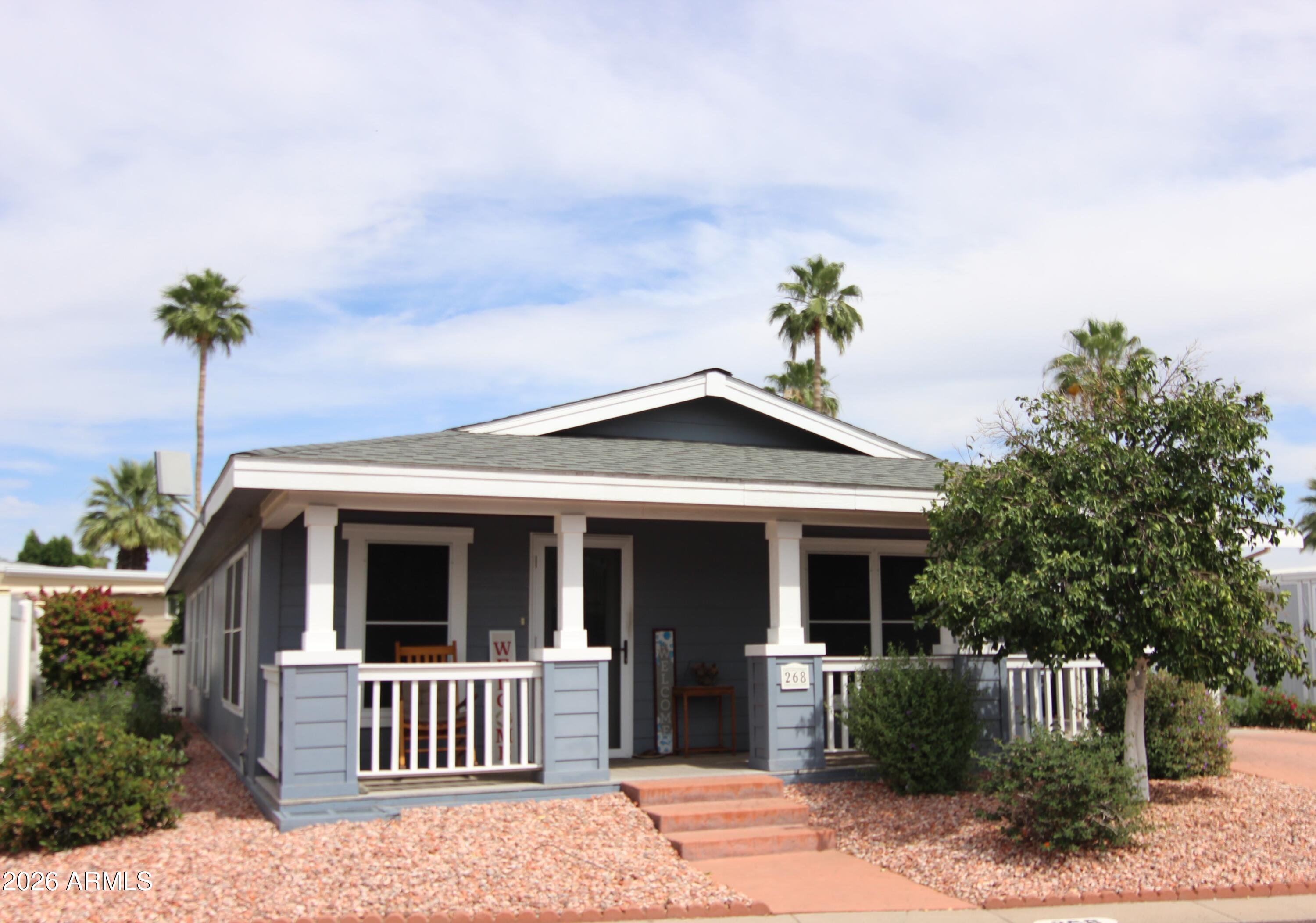 201 South Greenfield Road, Unit 268 Mesa, AZ 85206 - Photo 2 of 22 a view of a house with palm tree front of house