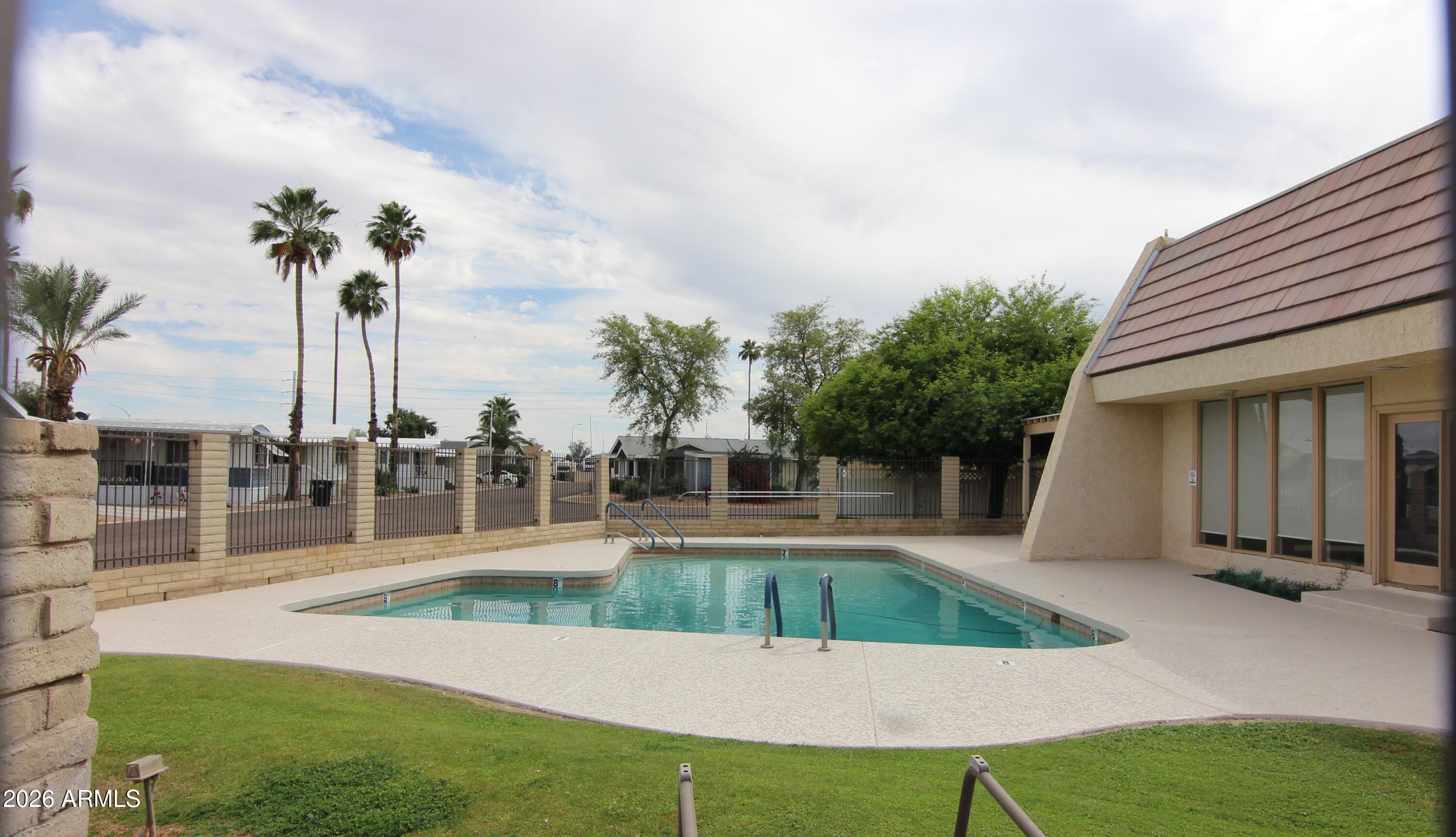 201 South Greenfield Road, Unit 268 Mesa, AZ 85206 - Photo 22 of 22 a view of a house with a swimming pool