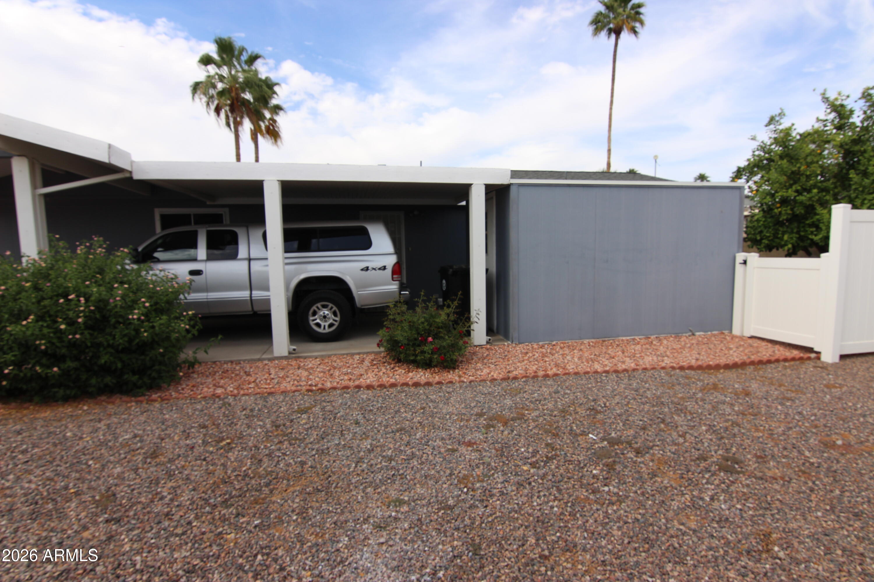 201 South Greenfield Road, Unit 268 Mesa, AZ 85206 - Photo 4 of 22 a front view of a house with a yard