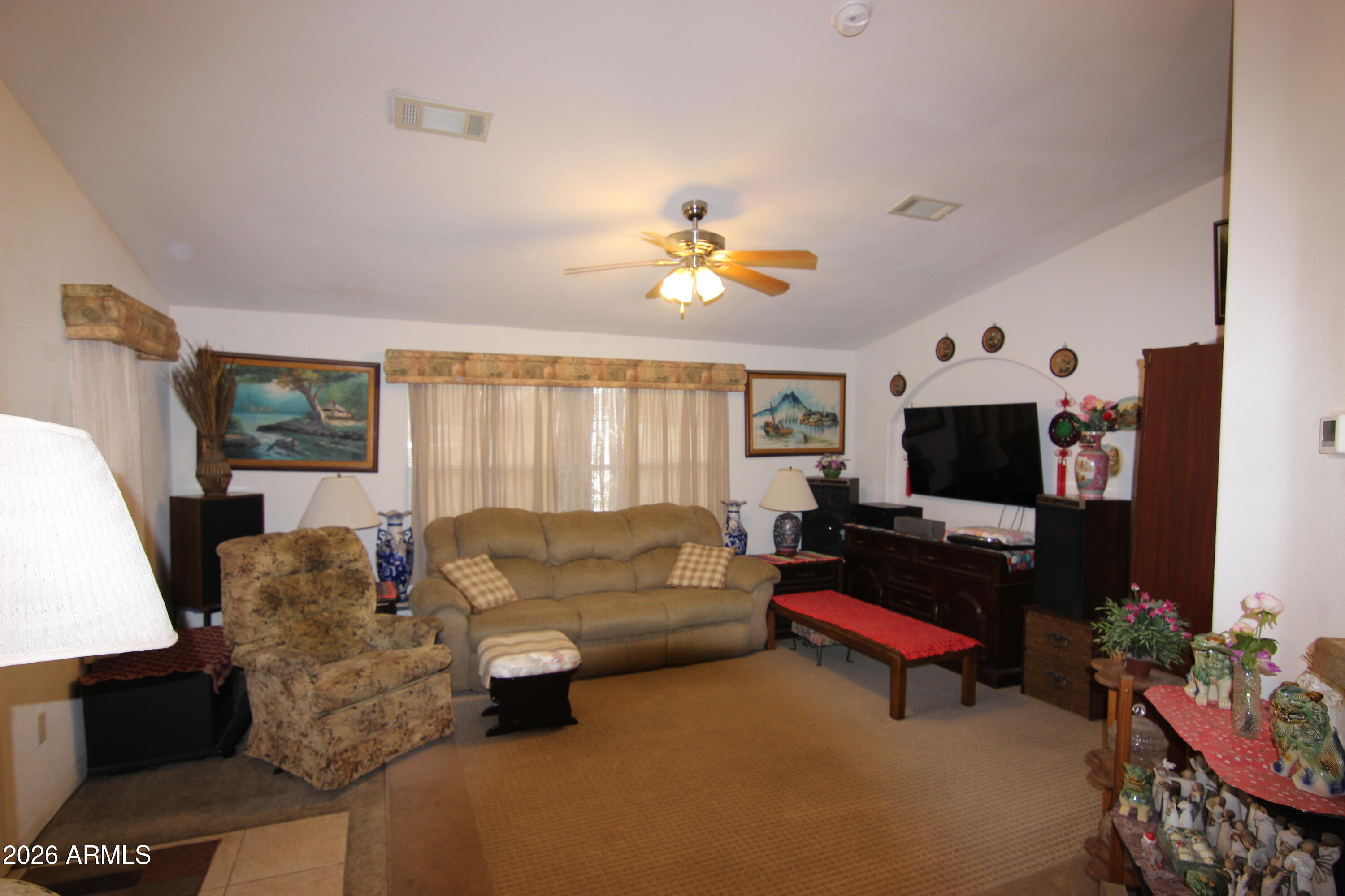 201 South Greenfield Road, Unit 268 Mesa, AZ 85206 - Photo 5 of 22 a living room with furniture and a flat screen tv