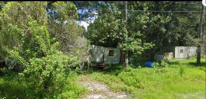 6927 Azlee Avenue New Port Richey, FL 34655 - Photo 2 of 8 a view of a yard