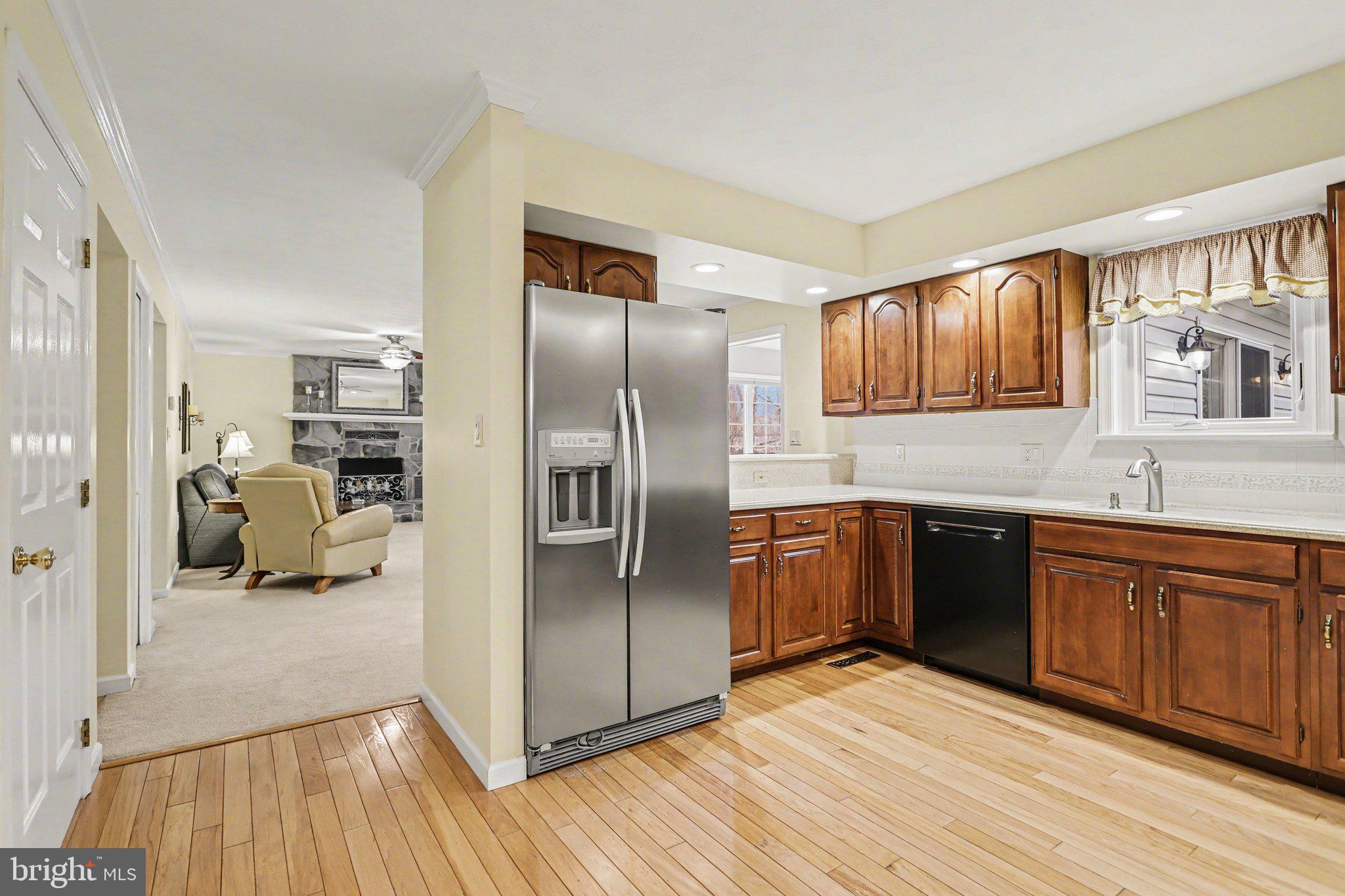 75 Longview Boulevard Gettysburg, PA 17325 - Photo 15 of 47 a kitchen with stainless steel appliances granite countertop a refrigerator and wooden cabinets