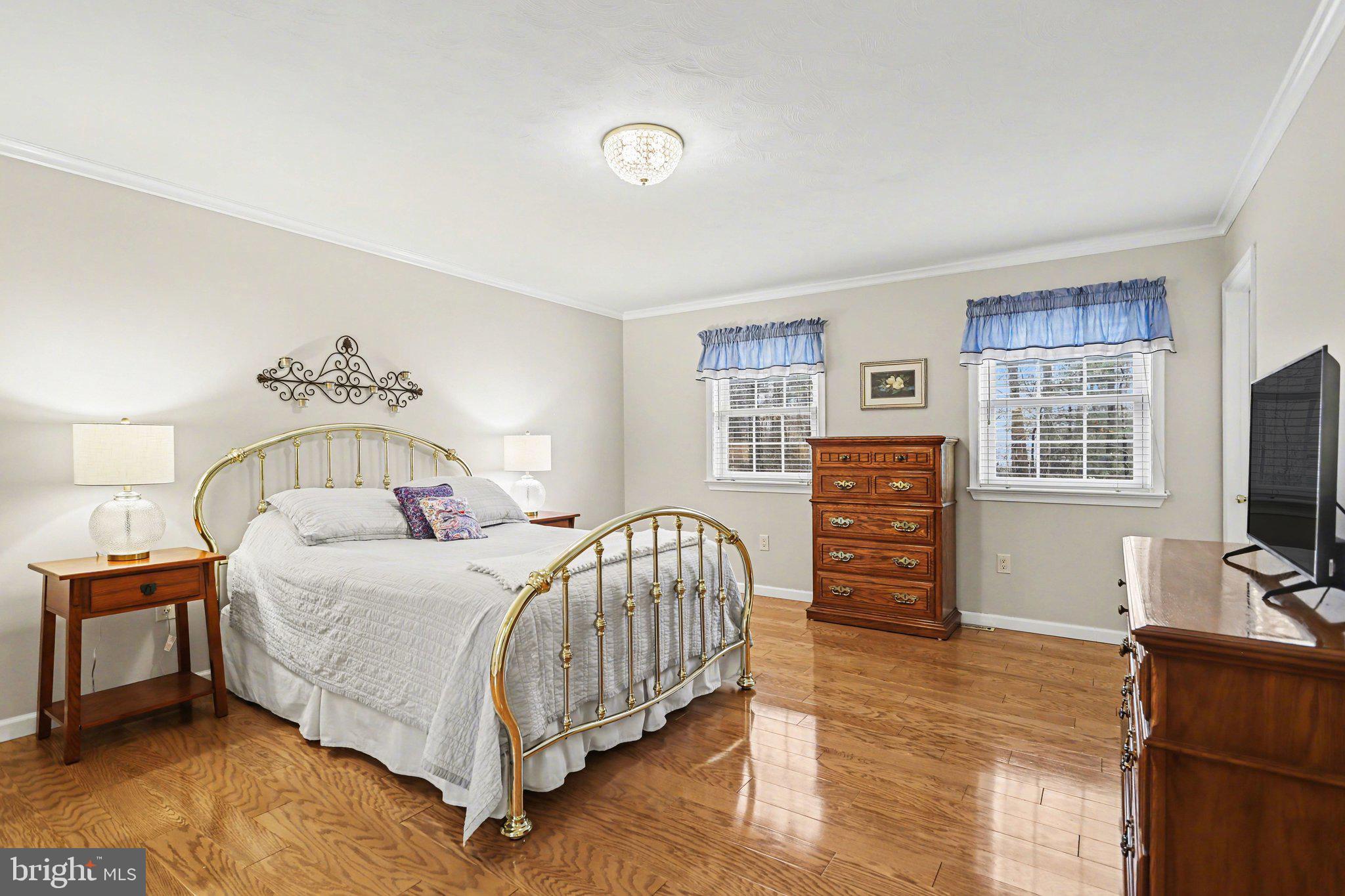 75 Longview Boulevard Gettysburg, PA 17325 - Photo 17 of 47 a bedroom with a bed a dresser and flat screen tv