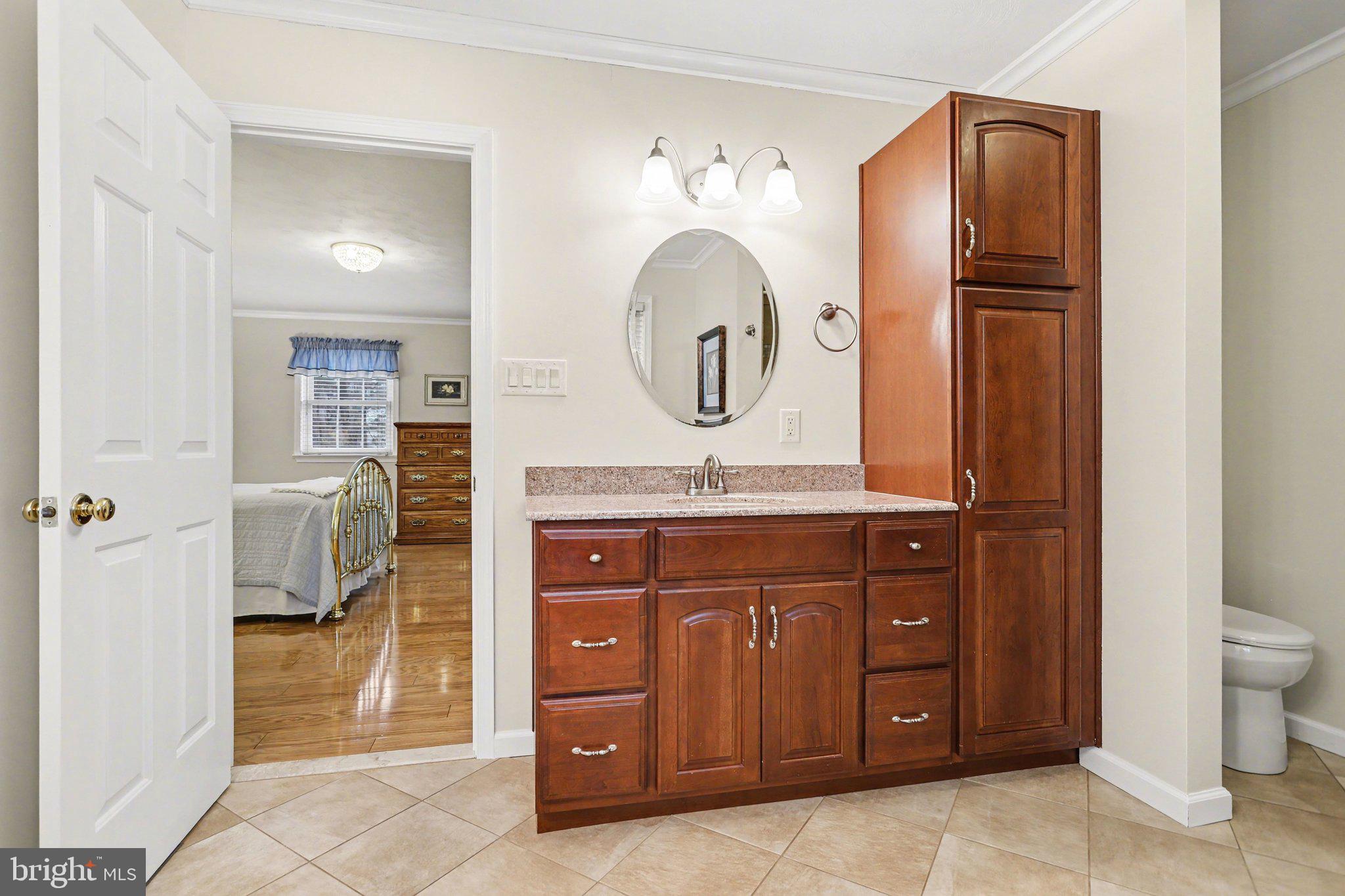 75 Longview Boulevard Gettysburg, PA 17325 - Photo 20 of 47 a bathroom with a granite countertop sink mirror vanity and toilet