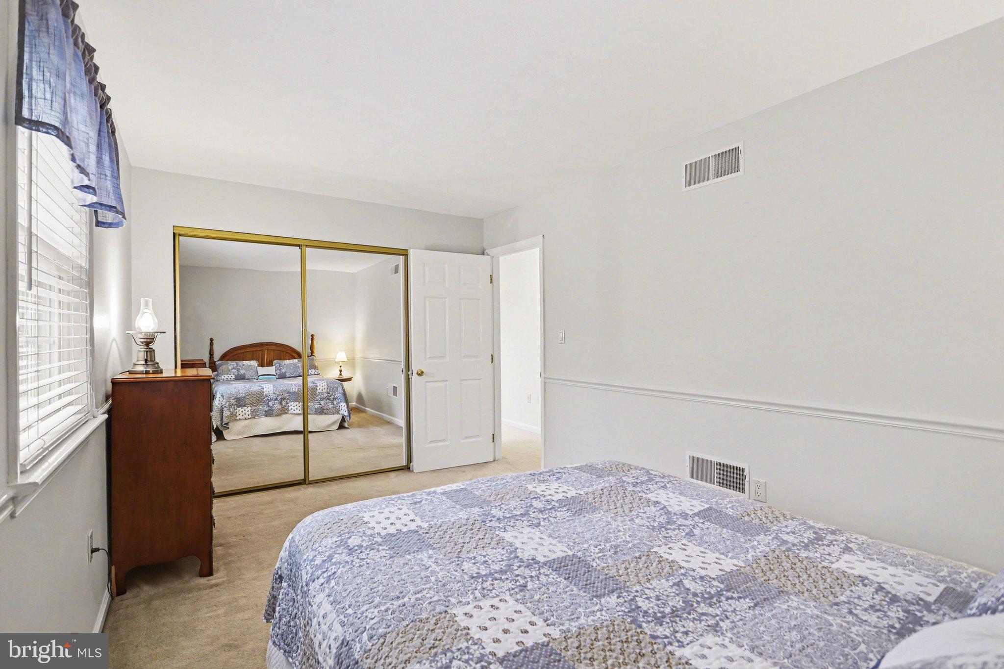 75 Longview Boulevard Gettysburg, PA 17325 - Photo 29 of 47 a bedroom with a bed and a large window