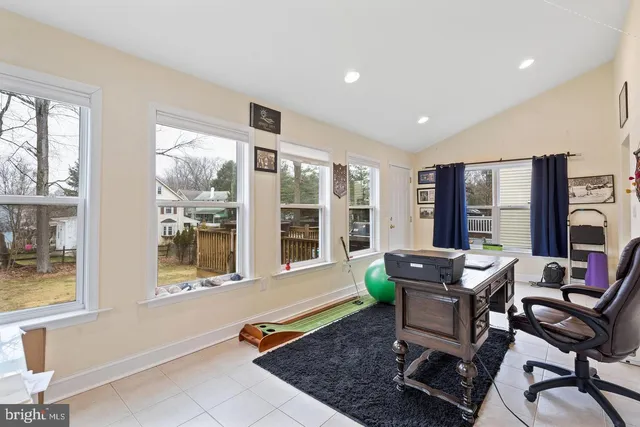 a dining room with furniture and windows