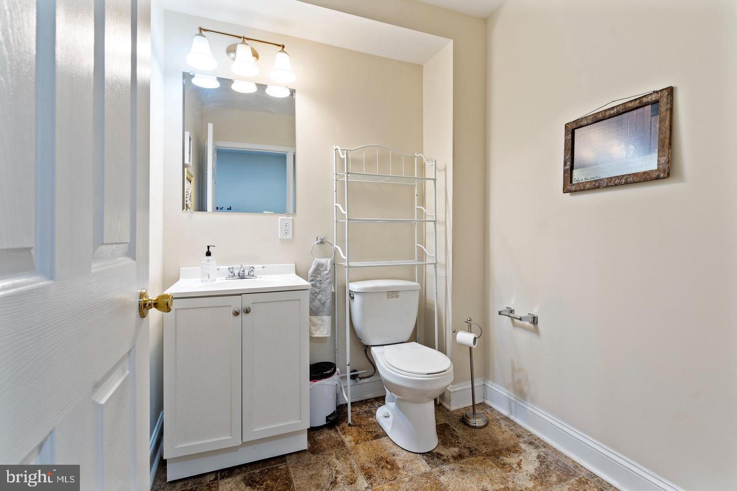 994 Upper Gulph Road Wayne, PA 19087 - Photo 12 of 24 a bathroom with a toilet sink and mirror