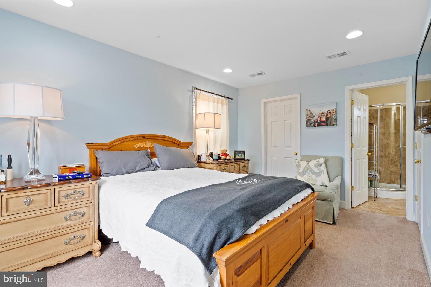 994 Upper Gulph Road Wayne, PA 19087 - Photo 13 of 24 a bedroom with a bed and a lamp