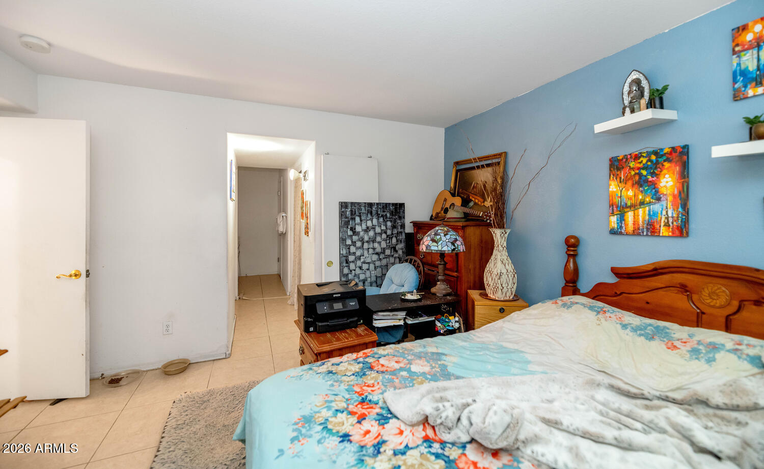 860 North McQueen Road, Unit 1121 Chandler, AZ 85225 - Photo 11 of 24 a bedroom with natural light and a bed