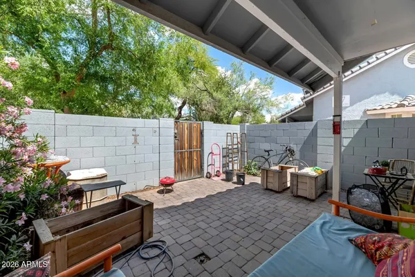 a backyard of a house with outdoor seating