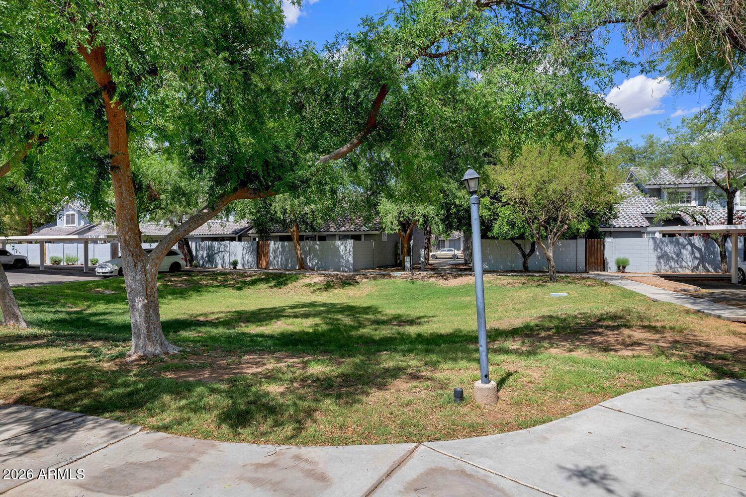 860 North McQueen Road, Unit 1121 Chandler, AZ 85225 - Photo 20 of 24 a view of a garden with a fountain