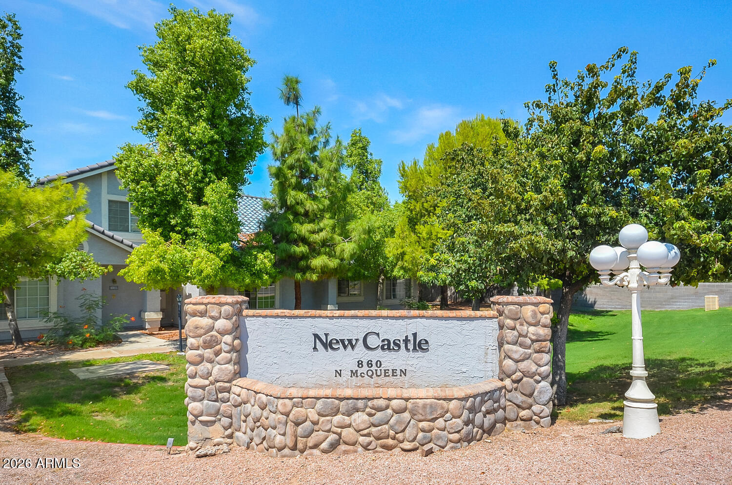 860 North McQueen Road, Unit 1121 Chandler, AZ 85225 - Photo 22 of 24 a sign on the side of the road