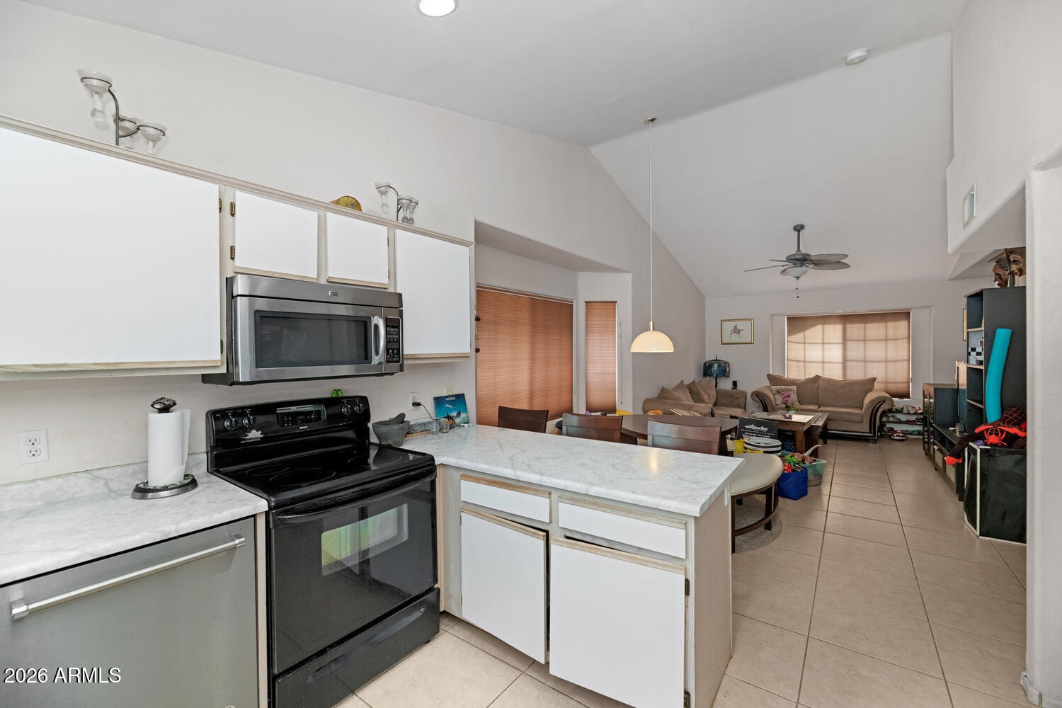 860 North McQueen Road, Unit 1121 Chandler, AZ 85225 - Photo 9 of 24 a kitchen with a sink stove and cabinets