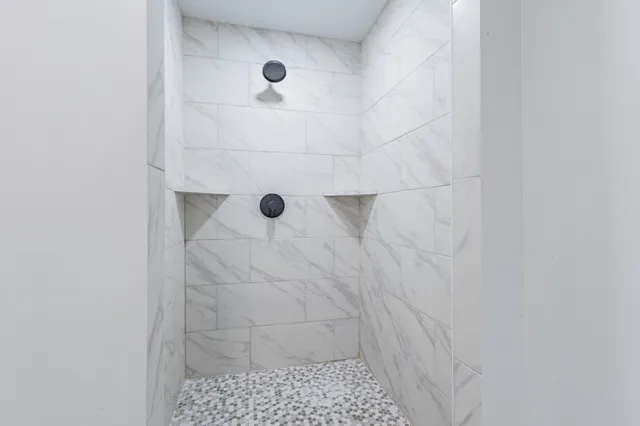 a kitchen with kitchen island a sink stove and refrigerator