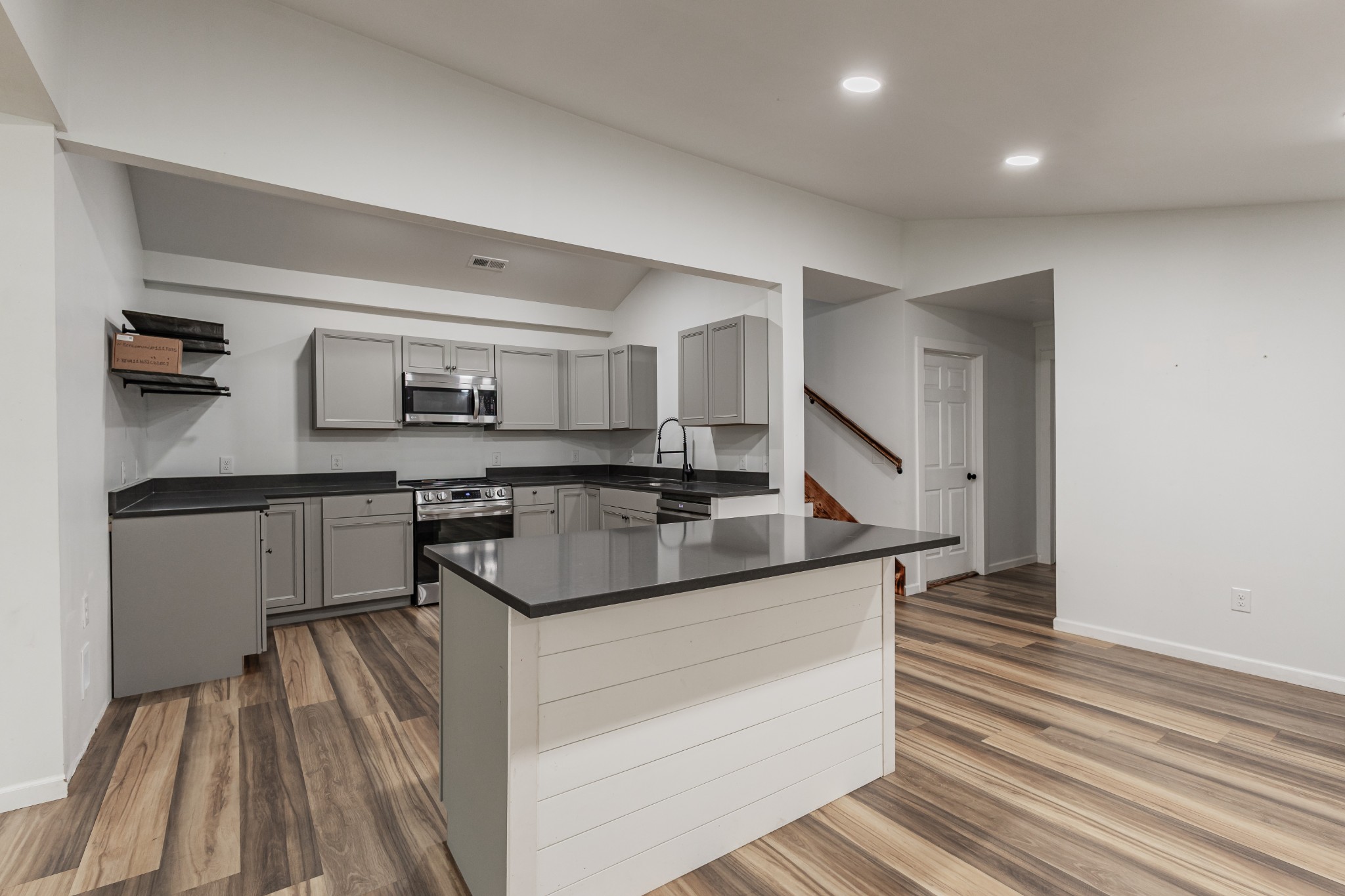 2635 McBrides Branch Road Beechgrove, TN 37018 - Photo 18 of 54 a kitchen with kitchen island a sink stove and refrigerator