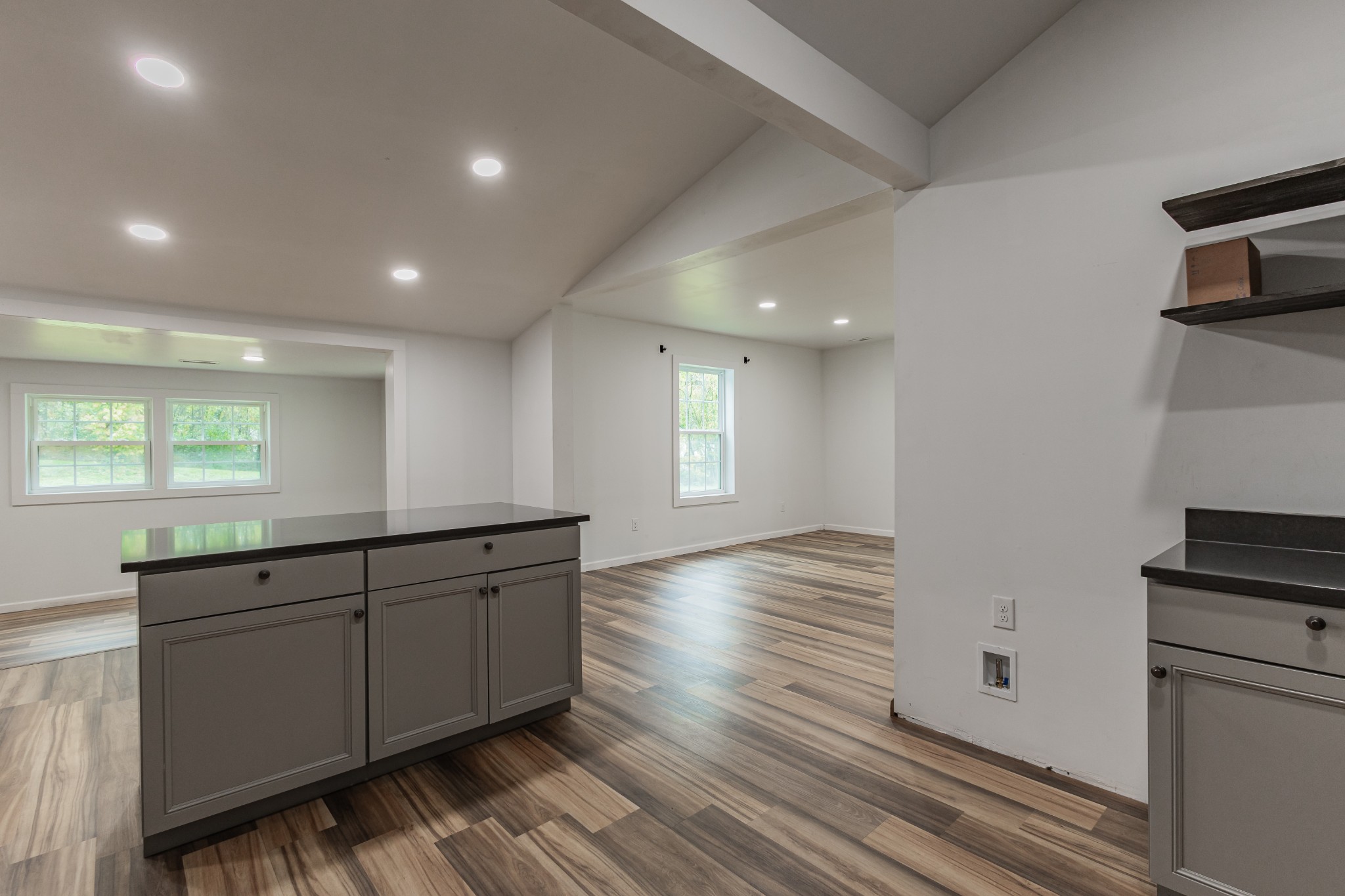 2635 McBrides Branch Road Beechgrove, TN 37018 - Photo 21 of 54 a large white kitchen with wooden floor and a sink